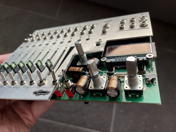 A Xer Mixa prototype with the bottom right corner chopped off the panel so that large capacitors could be installed