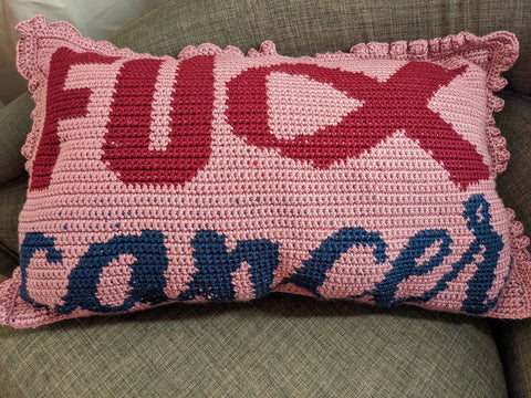 Pink pillow that says fuck cancer