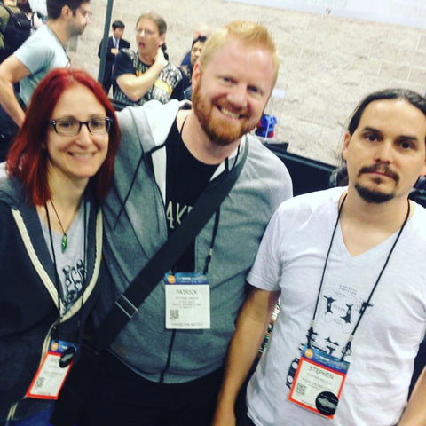 Kris, Patrick, and Stephen stand next to each other at NAMM. 