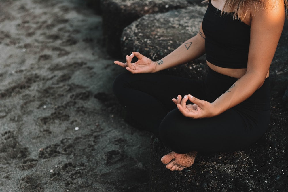 Girl Meditating with Niyama Sol Leggings