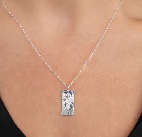 Silver pendant necklace with pine cone and pine bough