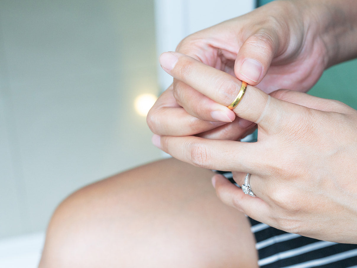 Woman struggling to remove her ring needs a lubricant