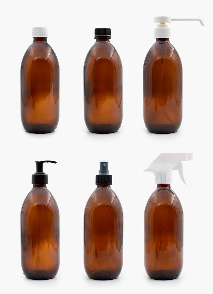 Six 100ml Glass Amber Bottles With Examples Of Closures On White Background | Brightpack Glass Packaging