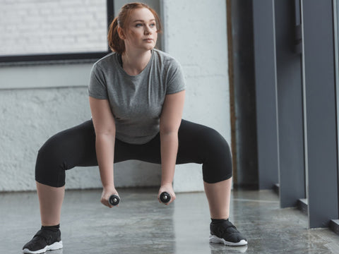 bulky fitness lady lifting weight