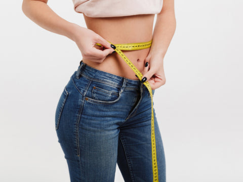 fitness girl with measuring tape