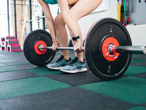 fitness-girl-adding-more-reps-during-leg-workout