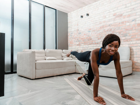 fitness-girl-doing-Donkey-Kick- with-a-Resistance-Band