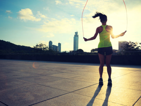 fitness girl skipping during the evening