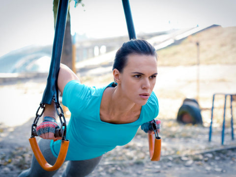 lady using hand gloves for outdoor workout