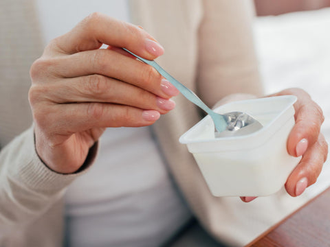 fitness lady eating yogurt