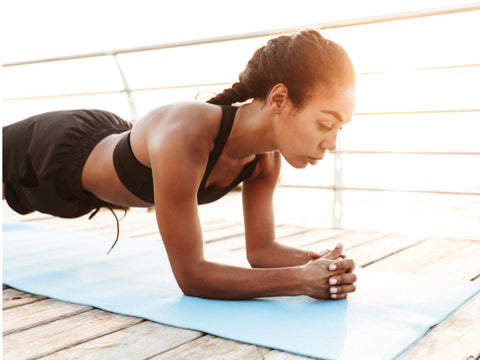 fitness girl doing plank exercise to strengthen core