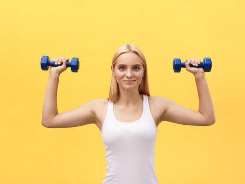 fitness lady wearing white lifting two weights