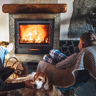 relaxing with the family by a fireplace from hearth and home