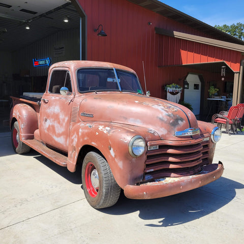 Old Chevrolet farm truck by the barn.