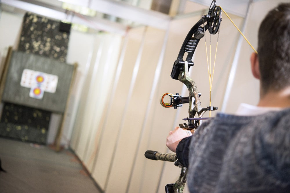 An archer at an indoor range