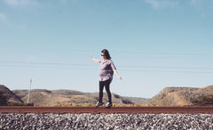 pregnant Doris balancing on the train track at santa cruz, CA