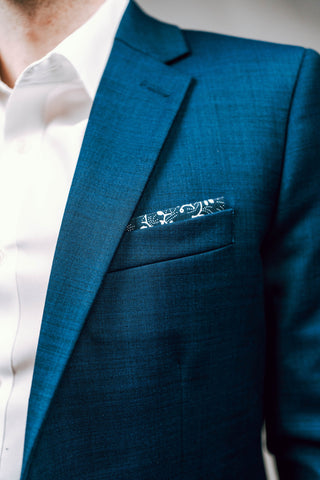 Classic stylish navy suit with patterned pocket square