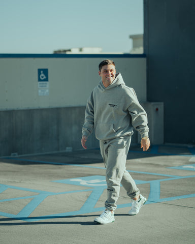 Man in athleisure sweatshirt and sweatpants