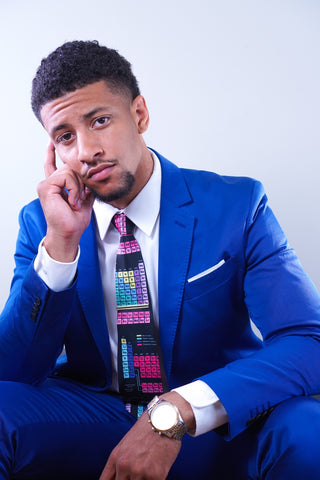 Man in bright blue suit with colourful flashy tie
