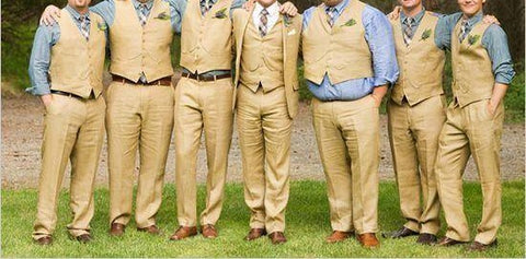 Wedding party with the Groom in a tan suit and white shirt and the wedding party matching in tan vests, pants and a blue shirt that do not fit