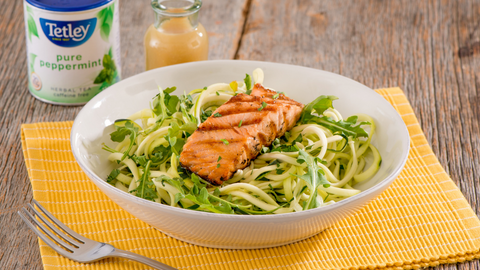 Beautiful food photography: a bed of spiralized zucchini beneath a piece of grilled salmon. Recipe made using Tetley Pure Peppermint tea. 