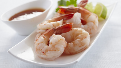 Beautiful food photography: a tray of poached shrimp with a side of homemade dipping sauce. Recipe made using Tetley Pure Green tea. 