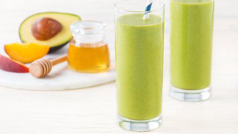 Beautiful food photography: two tall glasses filled with the smoothie. Recipe made using Tetley Pure Green tea.