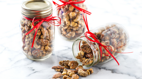 Beautiful food photography: three jars filled with a medley of sweet mixed nuts, perfect for snacking. Recipe made using Tetley Chai tea. 