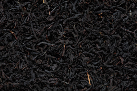 A close up of loose black tea leaves.