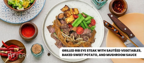 Grilled Rib Eye Steak with Sautéed Vegetables, Baked Sweet Potato, and Mushroom Sauce