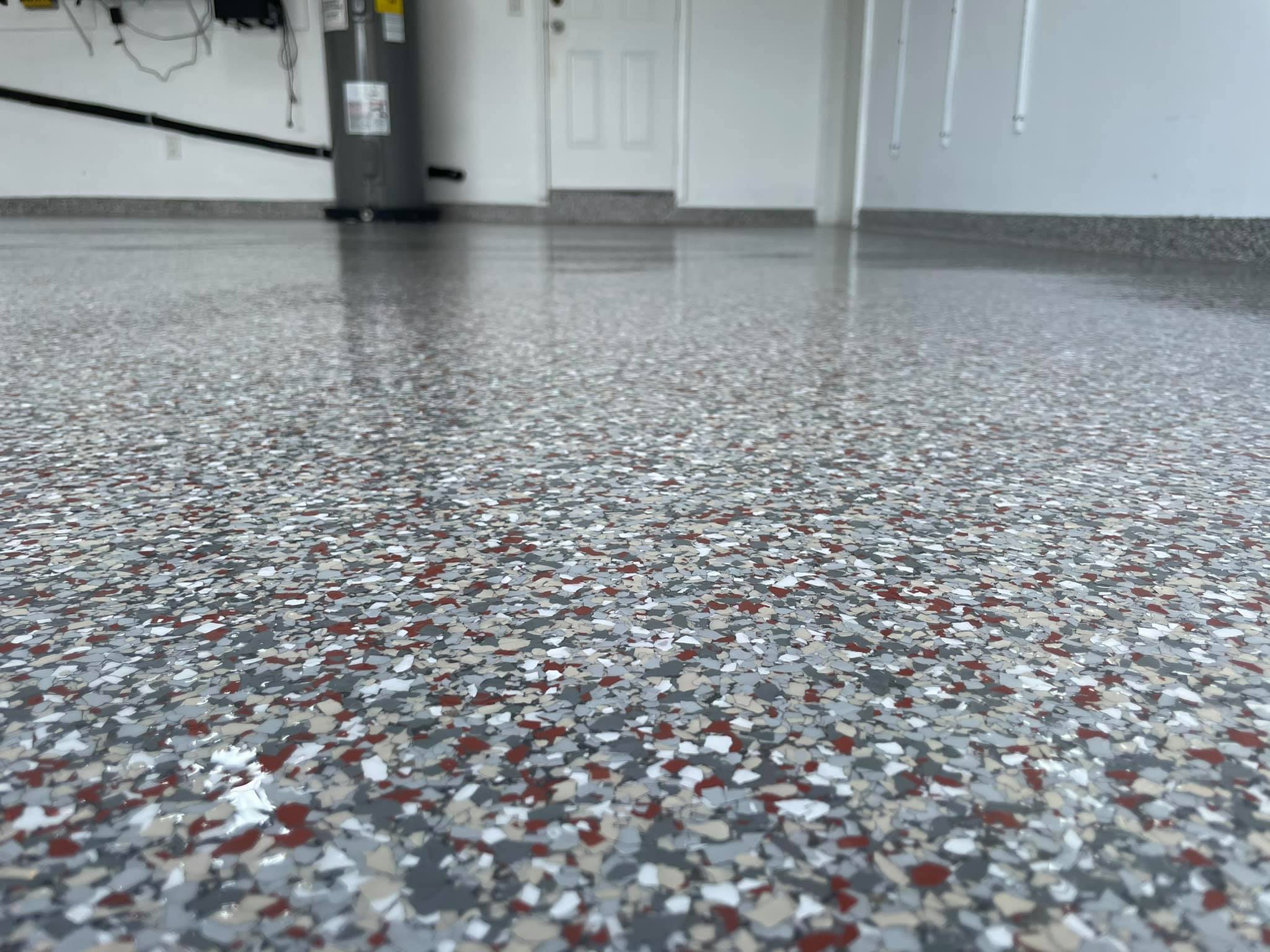 A finished epoxy flake floor coating in a residential garage | Xtreme Polishing Systems