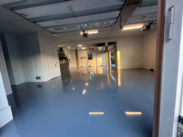 A plain colored epoxy garage floor finish.