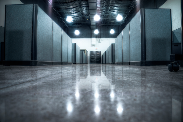 An image of a highly reflective and shiny concrete floor finish inside a commercial building.