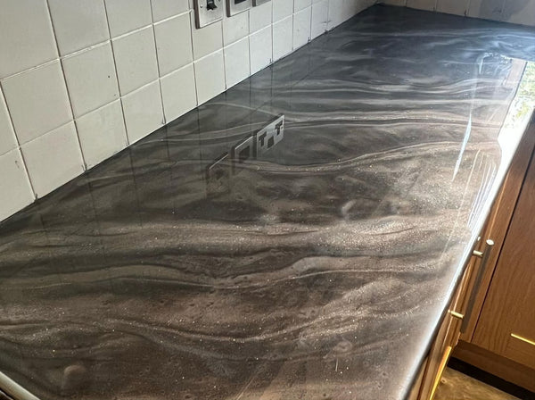 An image of a grey and silver metallic epoxy kitchen countertop.