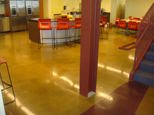 An image of highly reflective and shiny concrete floor inside of a commercial dining hall.