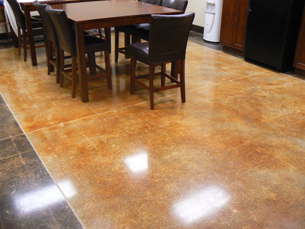 A decorative concrete floor inside a kitchen.