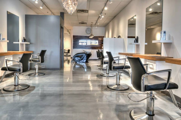 A metallic silver epoxy floor inside a salon.