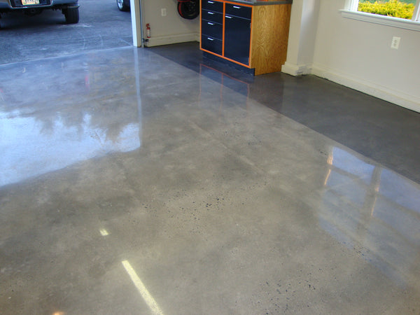 A high-sheen polished concrete floor inside a garage.