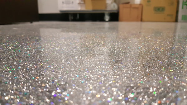 A holographic glitter epoxy floor.