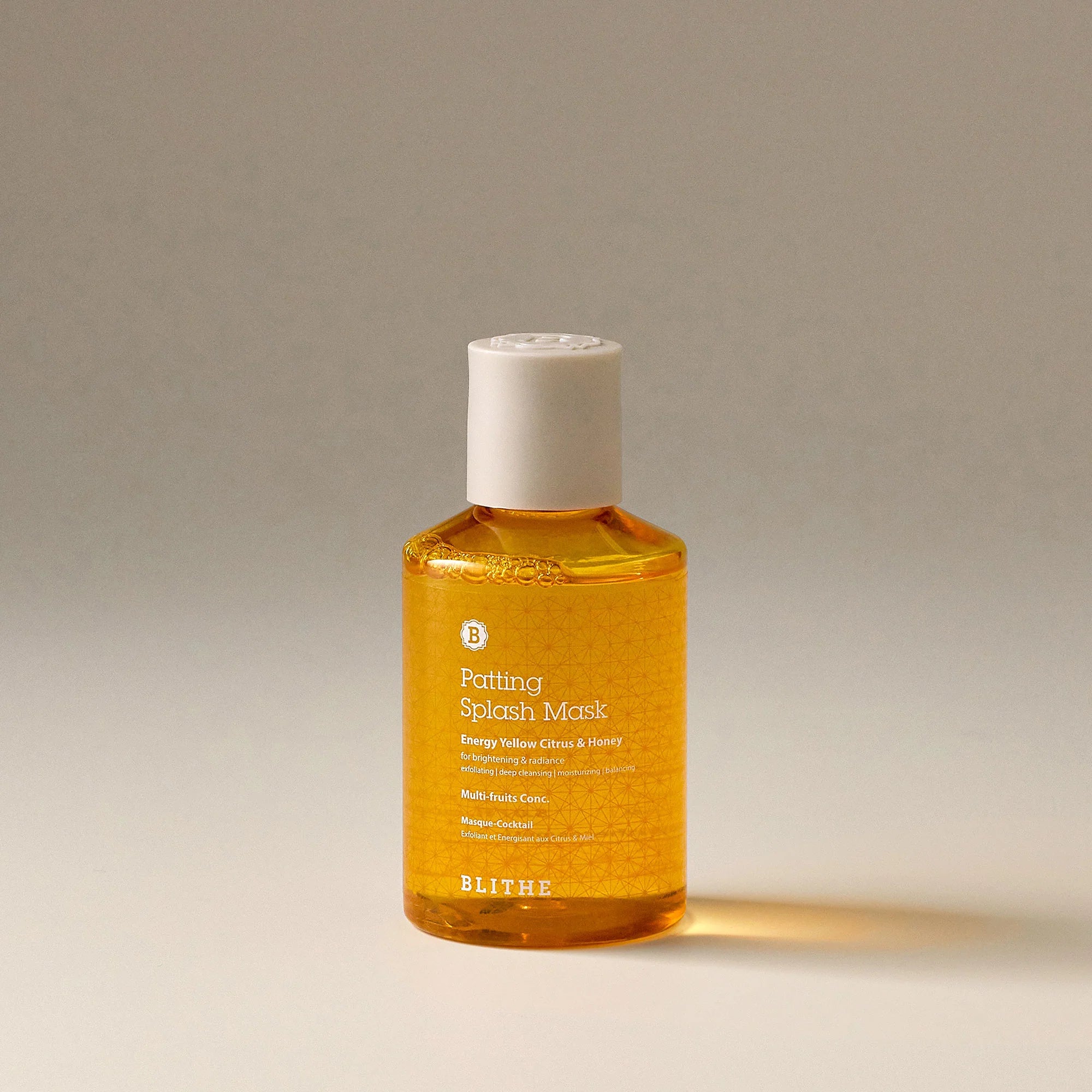 Blithe Cosmetics’ Patting Splash Mask in an orange bottle