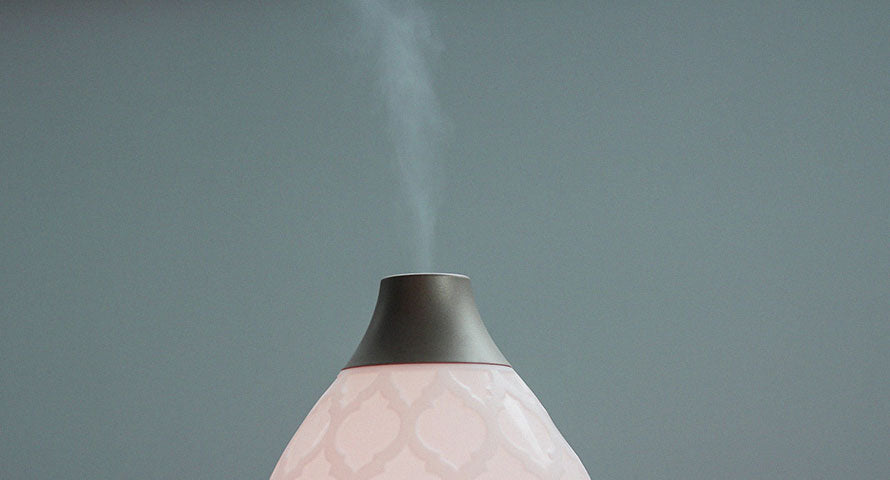 An image of a humidifier, showcasing its design and the mist it emits, symbolizing its role in maintaining indoor air moisture.