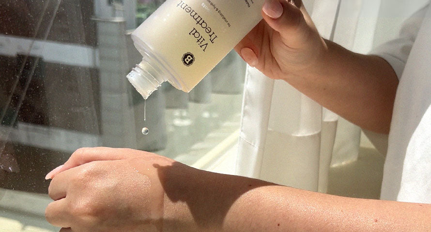 Image displaying someone applying Blithe Vital Treatment 5 Roots onto their arm, highlighting the product's smooth application and skin-nourishing properties.