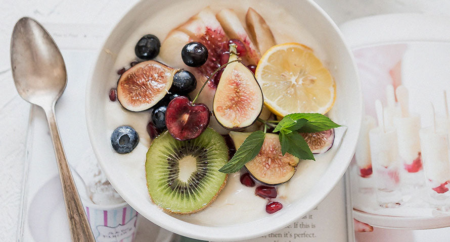 A vibrant assortment of fresh fruits neatly arranged on a plate, showcasing a variety of colors and textures, ready to be enjoyed.