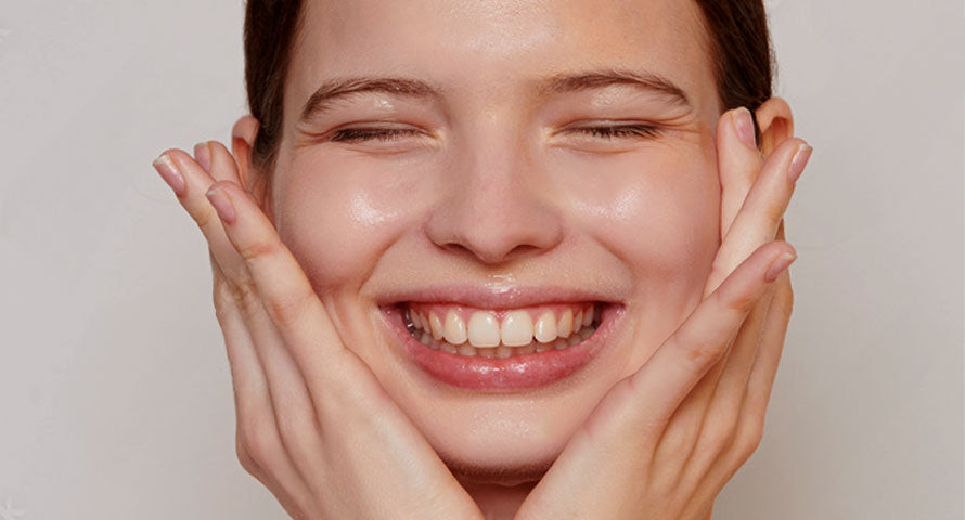 A smiling woman radiating joy and positivity, showcasing happiness and confidence.