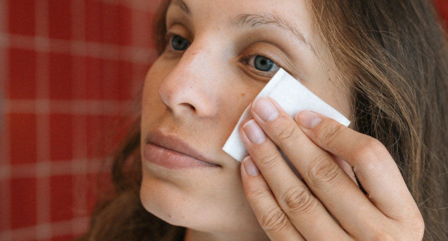 Macro shot of a woman's cheek with soft, smooth skin, highlighting effective moisturizing and cleansing routine.