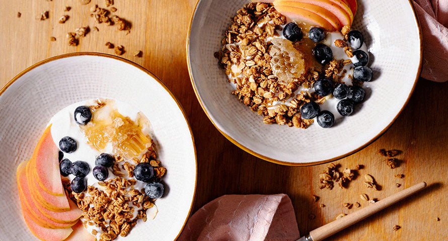 Healthy breakfast spread featuring whole grains, fresh fruit, yogurt, and nuts, showcasing a balanced and nutritious start to the day.