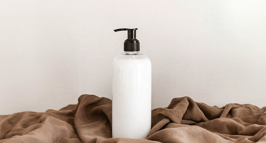 Image of an eco-friendly shampoo bottle, showcasing sustainable packaging design, typically made from recycled materials or biodegradable components, emphasizing the brand's commitment to environmental responsibility.