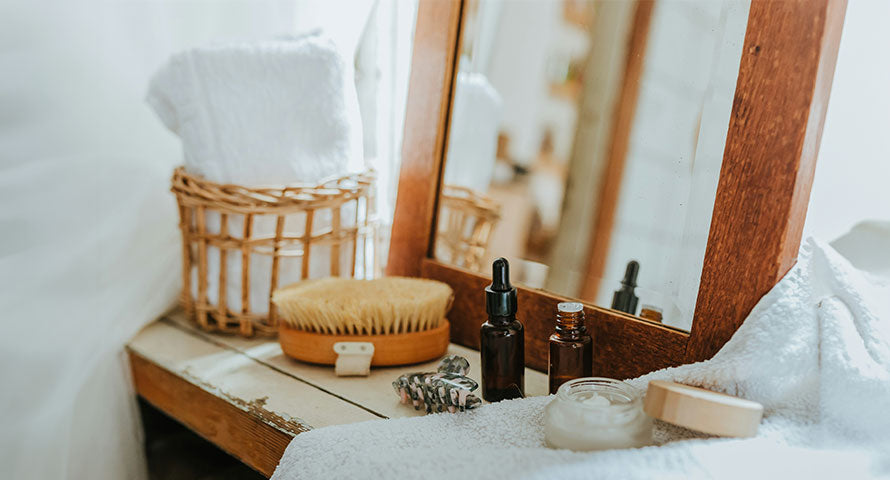 Image of a well-organized vanity covered with various skincare products, including serums, creams, and cleansers, neatly arranged to display a comprehensive skincare regimen.