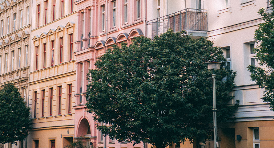 A panoramic view of densely populated apartment buildings, illustrating the urban environment and its unique skincare challenges.