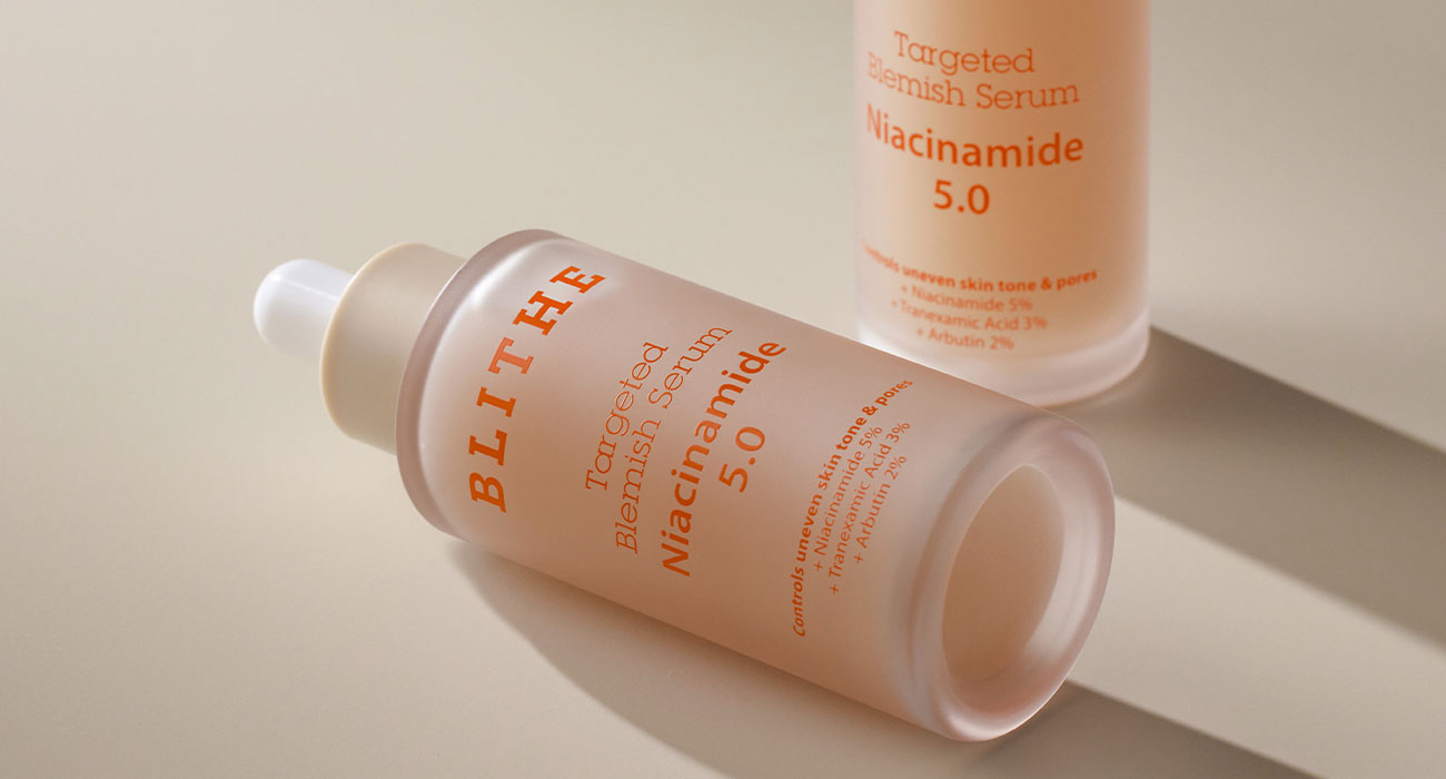 A close-up of the Blithe Targeted Blemish Serum featuring Niacinamide 5%, emphasizing the serum's clarity and the precision of its design, symbolizing its targeted, high-quality skincare solution.